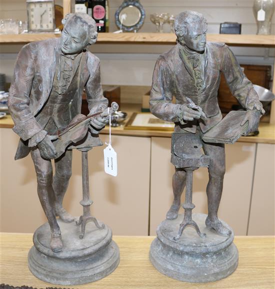 A pair of bronzed metal figures of musicians height 52cm